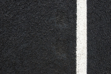 road and white road marking with text space seen from above.