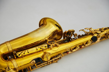 old saxophone on white background
