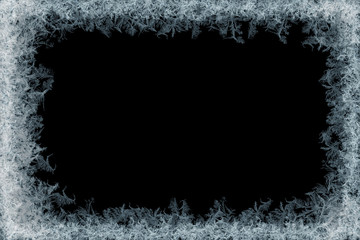 Frostwork. Decorative ice crystals frame on black matte background. 