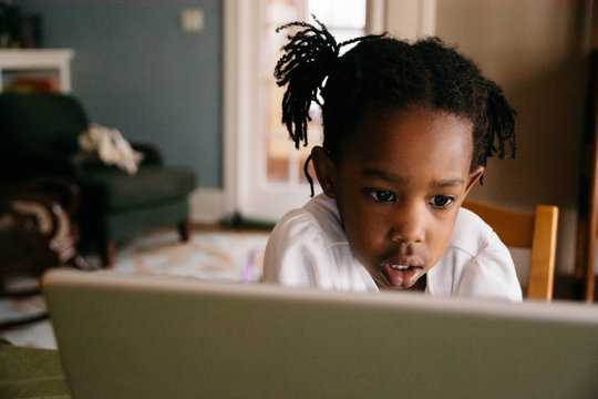 Black Girl Watching Movie On A Laptop Computer