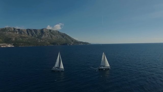 Aero shooting of two yachts in the open sea