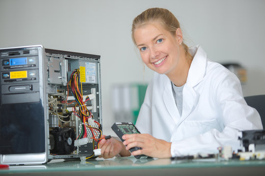 Female technician working on computer