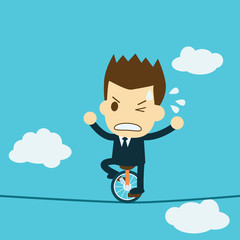 Businessman riding a unicycle on a tightrope. © ungtaman