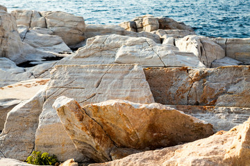 Aegean seashore and marble rocks in Aliki, Thassos island, Greece
