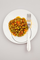 Stew with peas, carrots, onions, tomato sauce and spices
