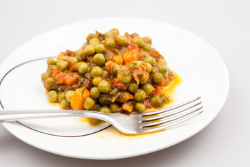 Stew with peas, carrots, onions, tomato sauce and spices
