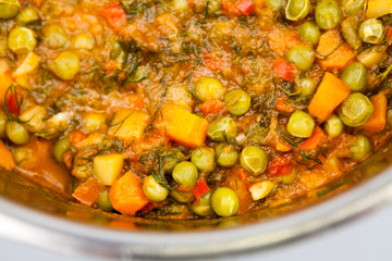 Stew with peas, carrots, onions, tomato sauce and spices
