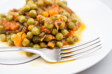 Stew with peas, carrots, onions, tomato sauce and spices
