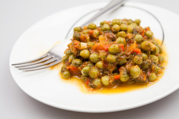 Stew with peas, carrots, onions, tomato sauce and spices
