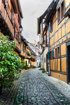Traditional french houses and shops in Eguisheim, Alsace, France