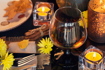 Table setting with autumn decoration for Thanksgiving.