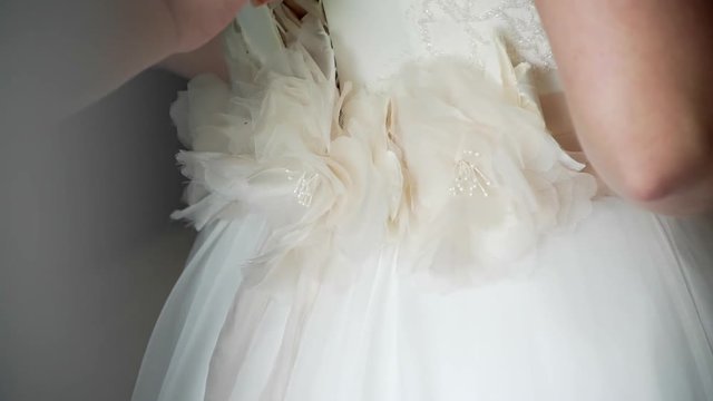 friend buttons bridesmaid dress. close-up