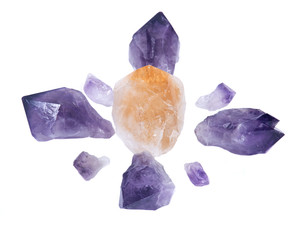 Amethyst and citrine natural points arranged in crystal grid isolated on white background