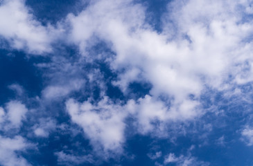 bright blue sky with clouds and sun. cumulus, background, weather.