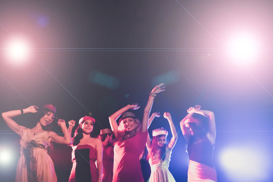 new year party, holidays, celebration, nightlife and people concept - Young people having fun dancing at a party.
