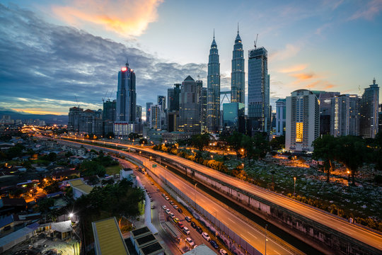 Kuala Lumpur skyline and skyscraper with highway road at night in Kuala Lumpur, Malaysia. Asia.