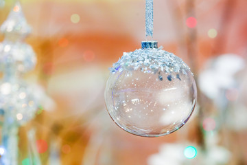 Obraz na płótnie Canvas beautiful crystal glass christmas ball on a colored background