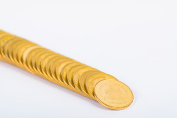 Columns of gold coins, piles of coins on white background