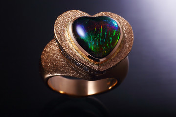 ring in gold with gemstones , gems  and diamond,   jewelry with emeralds