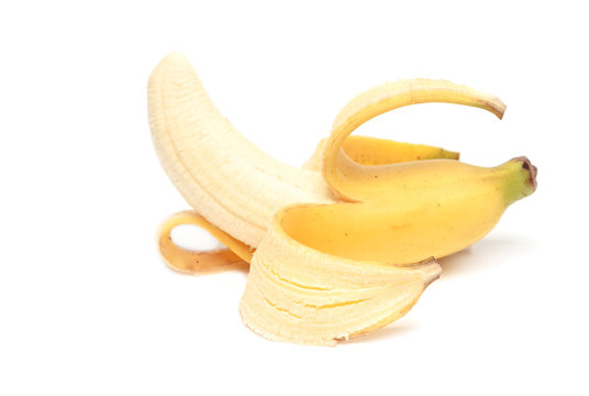 Fresh peeled banana isolated on white background.