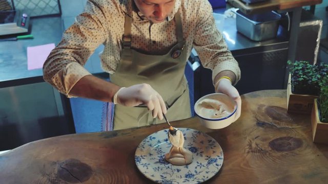 Shef cooking and smoking trout, river fish at restaurant