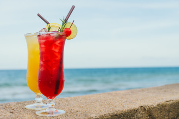 Iced cocktails drinking glass with beach and sea