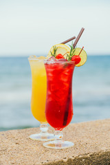 Iced cocktails drinking glass with beach and sea