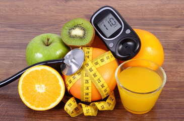 Glucose meter for checking sugar level, stethoscope, fruits, juice and centimeter