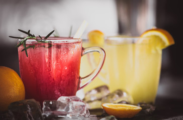 Pomegranate and orange cocktails with ice