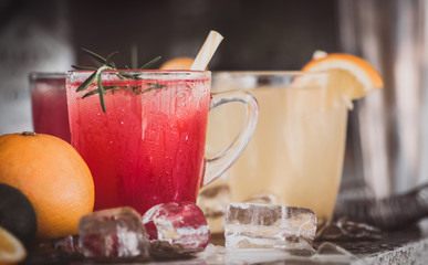 Pomegranate and orange cocktails with ice