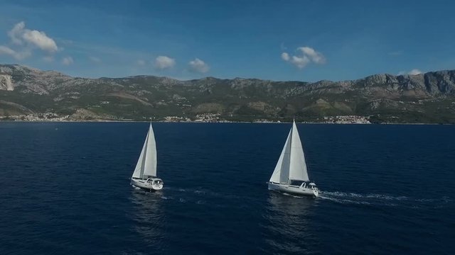Aero shooting of two yachts in the open sea