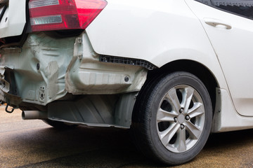Back white city car after accident.