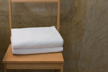 Fototapeta na wymiar White towels on wood table.