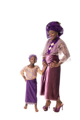 Beautiful African woman and lovely little girl in traditional purple costume,isolated