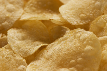 Close up potato chips on wood top view background..