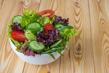 Fresh salad with mixed greens, cherry tomato and cucumber