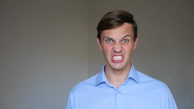 4k. Slow motion. Close up portrait of a young man. body language and gestures. he gets angry and yells at the camera