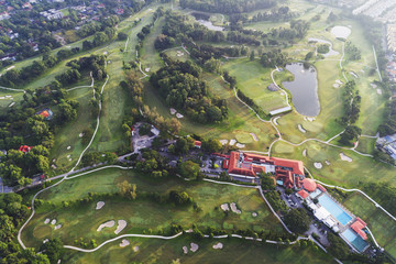 Aerial view. A golf course during sunrise.