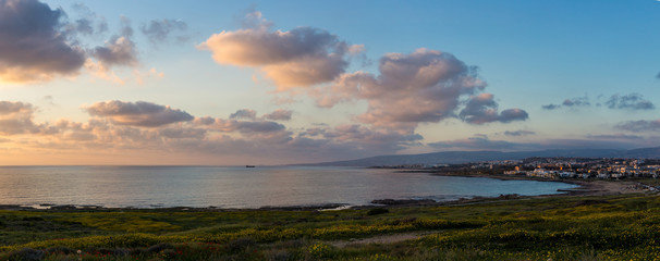 Landscape: Panorama of the sea shore near Paphos at sunset. Cyprus.