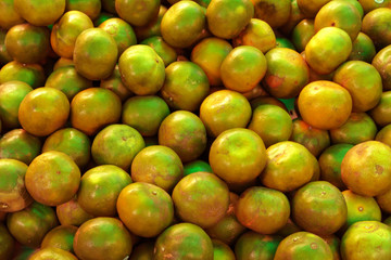 top view,many delicious tangerine in supermarket,abstract background