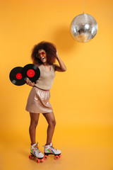 Full length portrait of a excited afro american woman