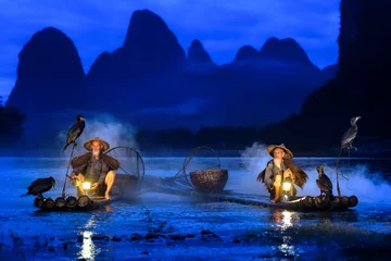 Papier Peint photo Guilin Fisherman of Guilin, Li River and Karst mountains during the blue hour of dawn,Guangxi China