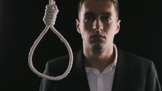 unhappy businessman wants to commit suicide. The loss of money, the collapse of business or bankruptcy.