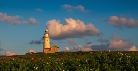 Fototapeta na wymiar Landscape: Lighthouse at sunset.