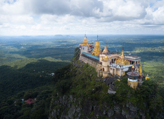 Aerial view from the drone on the Mount Popa,home of Nat the Burmese mythology ghost this place is the old volcano in Bagan, Myanmar