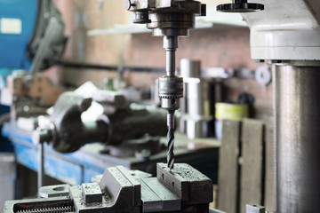 Drilling machine. The drill bit is installed in the drill chuck.