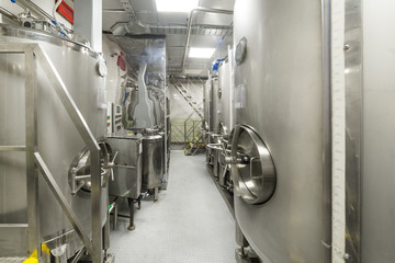 Large steel tanks for mixing liquids, modern production of alcoholic beverages.