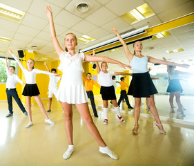 Children learn dance movements in dance class
