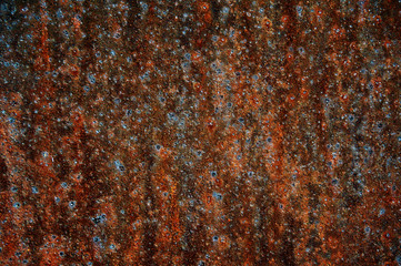 Rusted iron. Dark background. Abstraction.