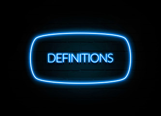 Definitions  - colorful Neon Sign on brickwall